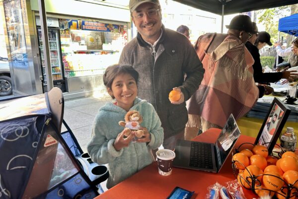 Health Fair Elmhurst Hospital_Girl smiling with Fede